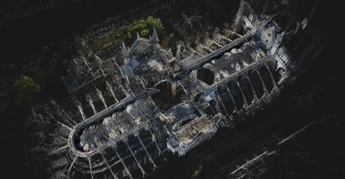 Aerial point cloud model generated via RealityCapture software showing the extent of the roof damage and collapsed vaulting inside Notre-Dame Cathedral.