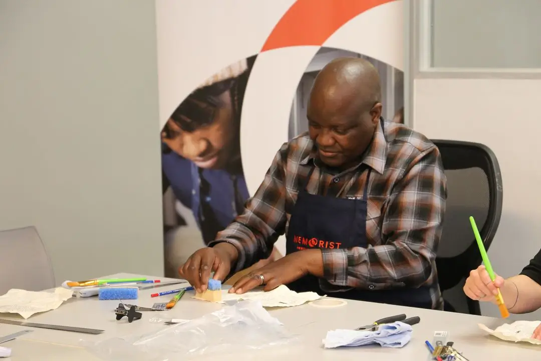 Participant carrying out practical paper conservation work during a MEMORIST training session